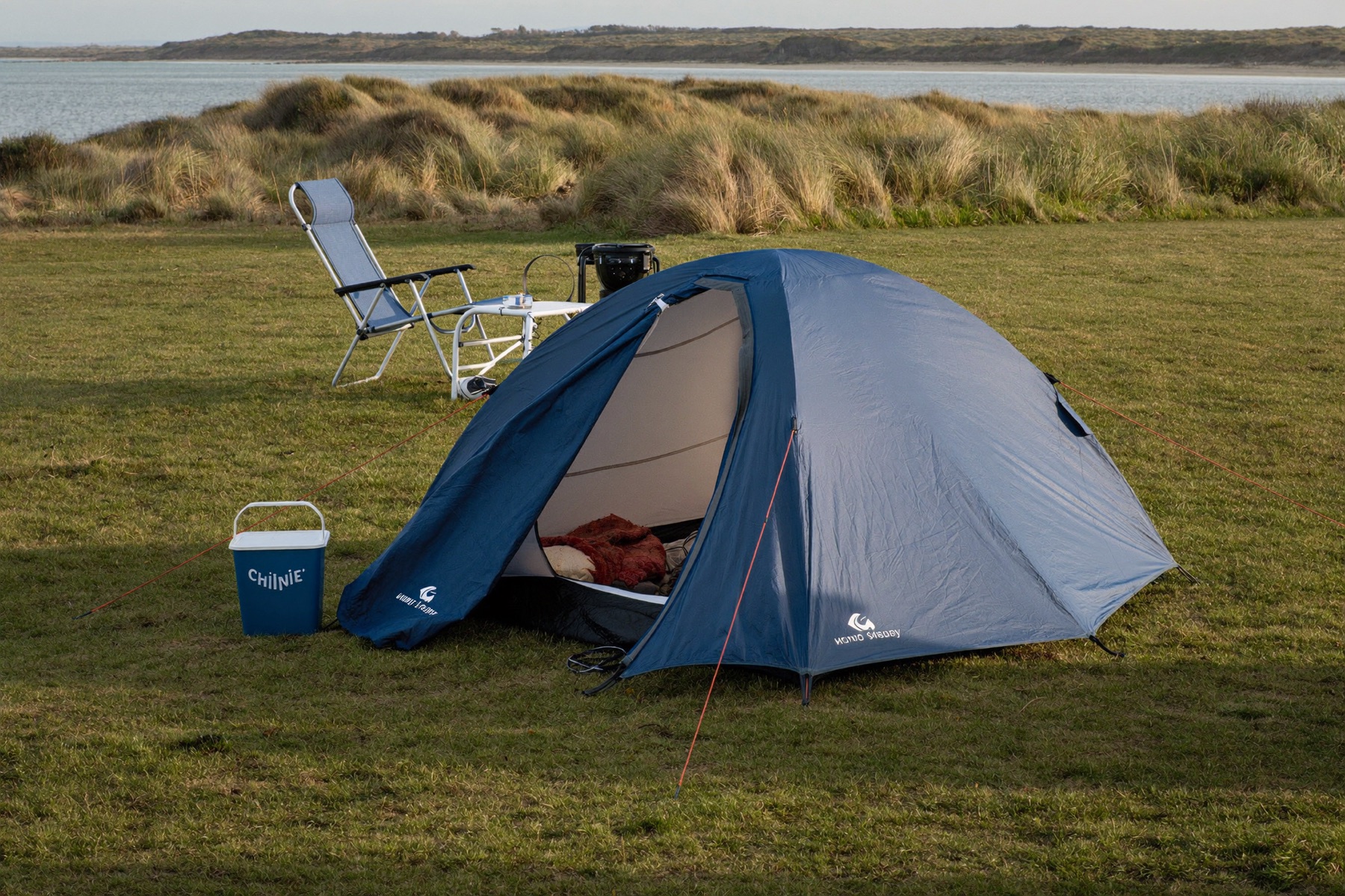 Tent on the grass near the beach